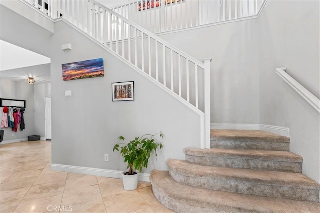 8489 Syracuse St, Riverside, CA 92508 - staircase featuring a high ceiling and tile patterned flooring