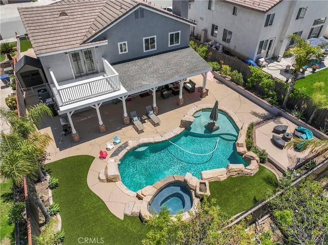 8489 Syracuse St, Riverside, CA 92508 - view of pool with a fenced backyard, a pool with connected hot tub, and a patio