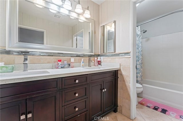 8489 Syracuse St, Riverside, CA 92508 - bathroom with double vanity, tile walls, tile patterned floors, and shower / bathtub combination with curtain