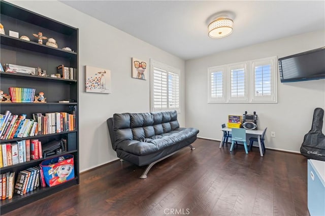 sitting room with wood finished floors and baseboards