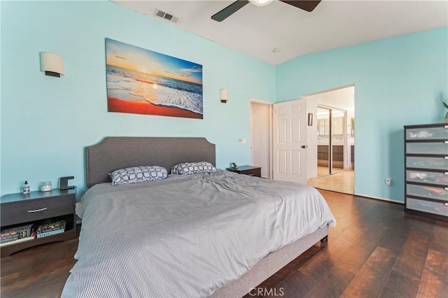 bedroom featuring wood finished floors, connected bathroom, a ceiling fan, and baseboards