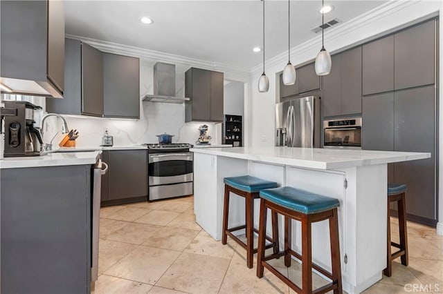 8489 Syracuse St, Riverside, CA 92508 - kitchen with stainless steel appliances, wall chimney exhaust hood, a center island, crown molding, and a breakfast bar area