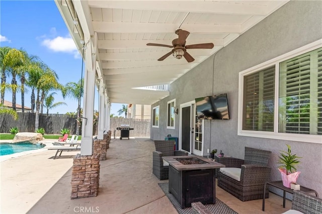 view of patio / terrace featuring a fire pit, a fenced backyard, grilling area, and ceiling fan