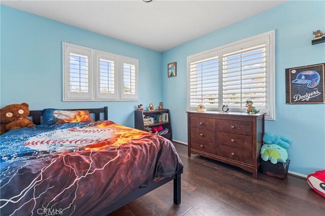 8489 Syracuse St, Riverside, CA 92508 - bedroom featuring wood finished floors and multiple windows