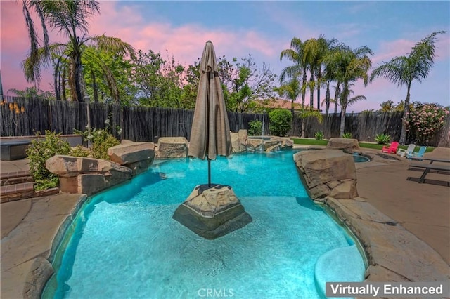 8489 Syracuse St, Riverside, CA 92508 - pool at dusk with a fenced backyard, a patio area, and an outdoor hot tub