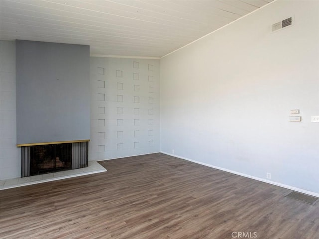 715 S Bradley Rd Unit 14, Santa Maria, CA 93454 - unfurnished living room with wood finished floors, a fireplace with raised hearth, and baseboards