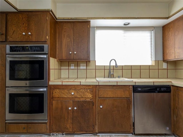 715 S Bradley Rd Unit 14, Santa Maria, CA 93454 - kitchen featuring appliances with stainless steel finishes, a sink, tile countertops, and healthy amount of natural light