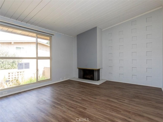715 S Bradley Rd Unit 14, Santa Maria, CA 93454 - unfurnished living room with lofted ceiling, dark wood-style flooring, a fireplace with raised hearth, and wood ceiling