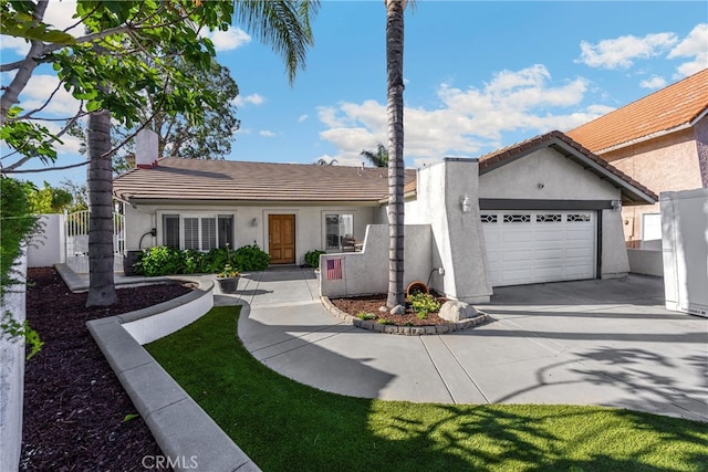 ranch-style home featuring stucco siding, driveway, a tiled roof, an attached garage, and fence