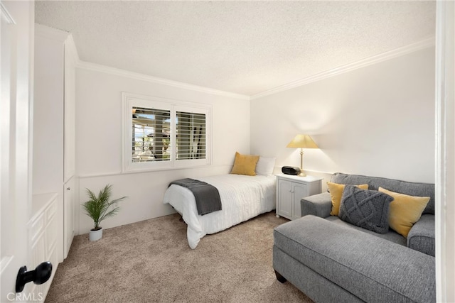 bedroom featuring carpet flooring, ornamental molding, and a textured ceiling
