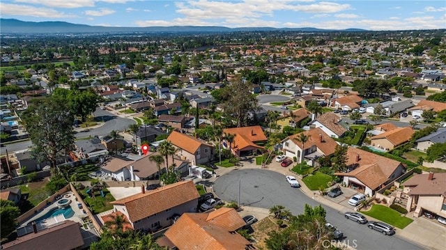 aerial perspective of suburban area with a mountainous background