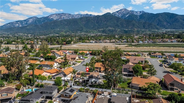 aerial view of residential area with mountains