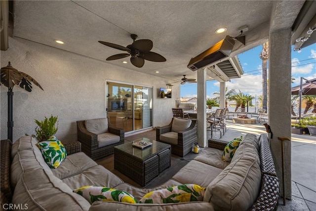 view of patio / terrace with an outdoor hangout area, ceiling fan, and outdoor dining space