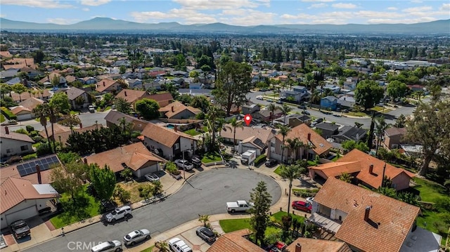 aerial view of residential area with a mountain backdrop