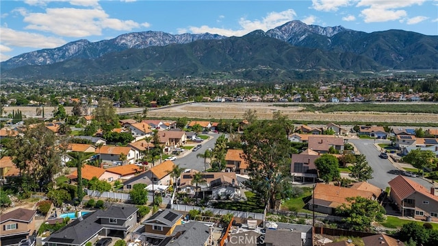 aerial view of residential area featuring a mountain backdrop