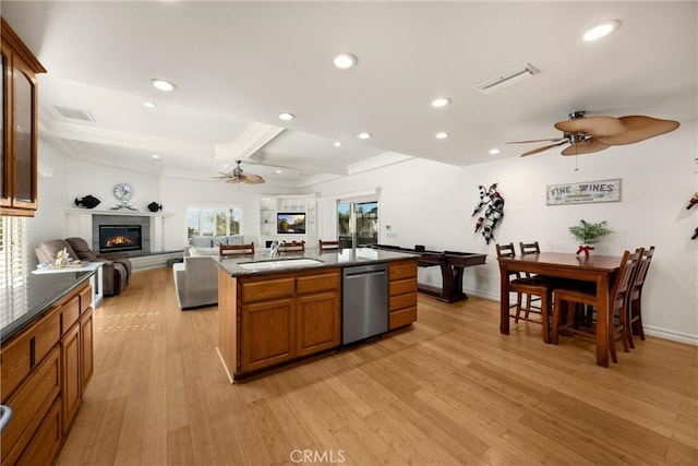 kitchen with a ceiling fan, dishwasher, a sink, open floor plan, and recessed lighting