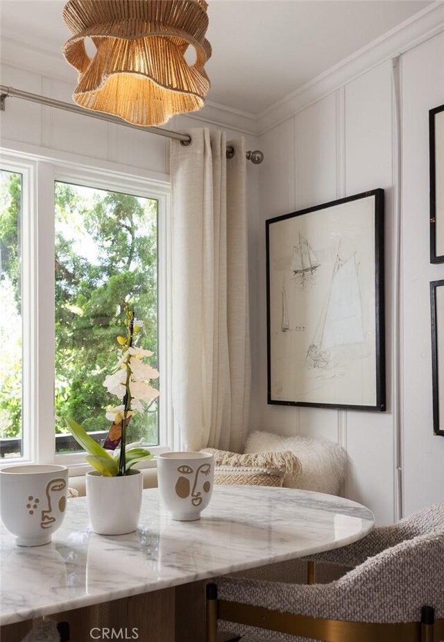 565 Lombardy Ln, Laguna Beach, CA 92651 - dining space featuring crown molding and a decorative wall