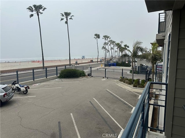 1202 N Pacific St Unit 204A, Oceanside, CA 92054 - uncovered parking lot with a water view and fence