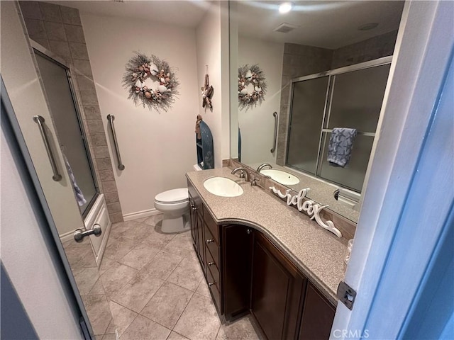 1202 N Pacific St Unit 204A, Oceanside, CA 92054 - bathroom featuring tile patterned flooring, vanity, toilet, combined bath / shower with glass door, and baseboards
