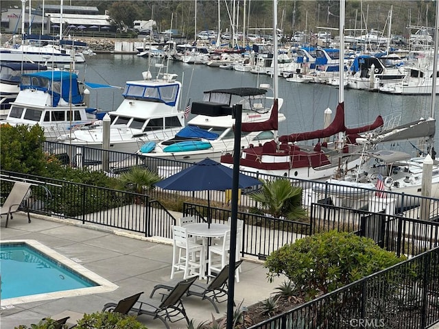 1202 N Pacific St Unit 204A, Oceanside, CA 92054 - dock featuring view of marina, a water view, and fence