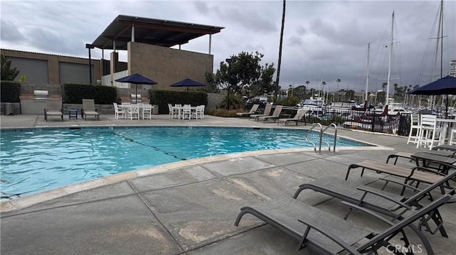 1202 N Pacific St Unit 204A, Oceanside, CA 92054 - community pool with a patio area and fence