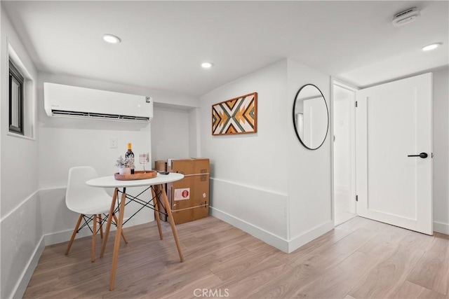4160 Hubbard St, Los Angeles, CA 90023 - dining area featuring a wall mounted air conditioner, light wood finished floors, baseboards, and recessed lighting