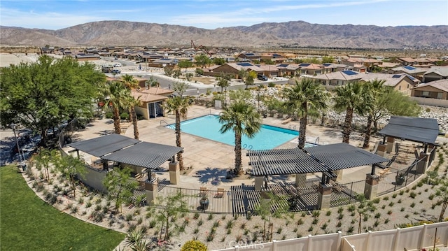 62892 Loftwood St, Desert Hot Springs, CA 92240 - community pool featuring fence, a residential view, and a mountain view
