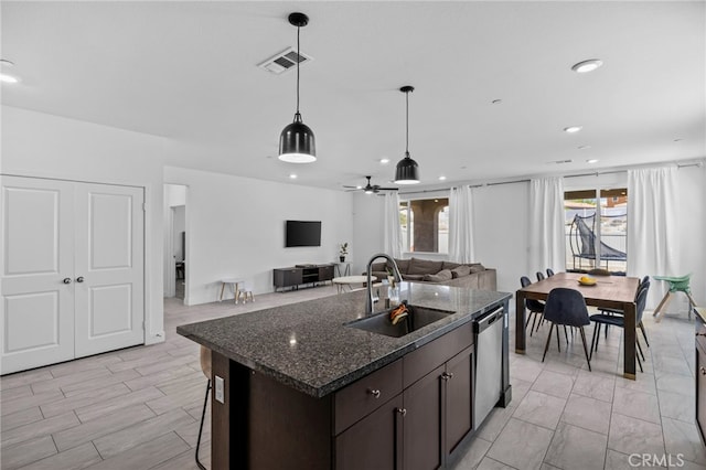 62892 Loftwood St, Desert Hot Springs, CA 92240 - kitchen with a sink, stainless steel dishwasher, dark brown cabinets, pendant lighting, and recessed lighting