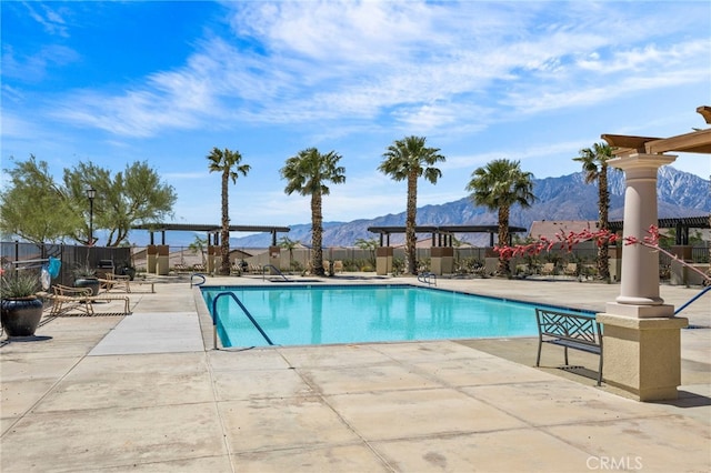 62892 Loftwood St, Desert Hot Springs, CA 92240 - community pool featuring a mountain view, a patio, and fence