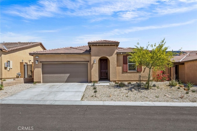 62892 Loftwood St, Desert Hot Springs, CA 92240 - view of front of property with stucco siding, an attached garage, concrete driveway, and a tiled roof