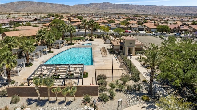 62892 Loftwood St, Desert Hot Springs, CA 92240 - community pool with a residential view, a mountain view, fence, and a patio