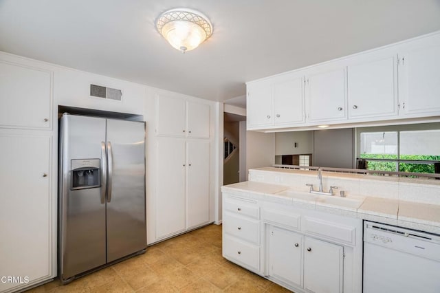 4213 Sarah St Unit 22, Burbank, CA 91505 - kitchen featuring stainless steel refrigerator with ice dispenser, white dishwasher, a sink, white cabinets, and light floors