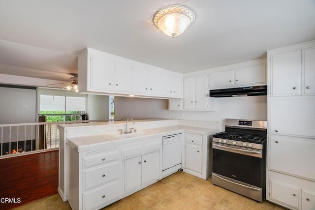 4213 Sarah St Unit 22, Burbank, CA 91505 - kitchen with gas range, under cabinet range hood, white dishwasher, a peninsula, and a ceiling fan