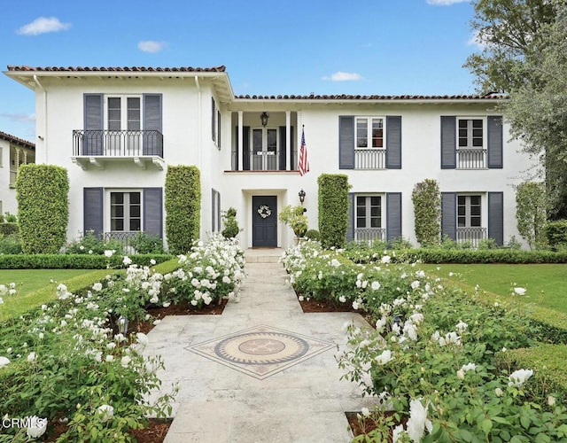 670 San Marino Ave, San Marino, CA 91108 - mediterranean / spanish-style house featuring stucco siding, a balcony, and a tile roof