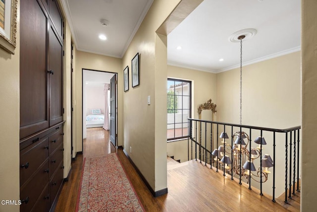 670 San Marino Ave, San Marino, CA 91108 - corridor with dark wood-style flooring, an upstairs landing, crown molding, a chandelier, and recessed lighting