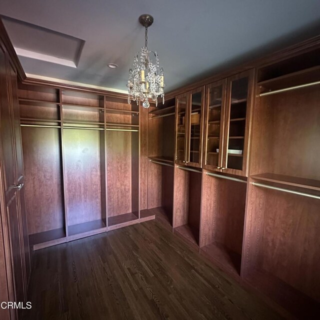 670 San Marino Ave, San Marino, CA 91108 - spacious closet featuring dark wood finished floors and a chandelier