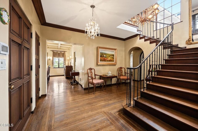 670 San Marino Ave, San Marino, CA 91108 - entrance foyer with a chandelier, stairway, dark wood-style floors, and ornamental molding