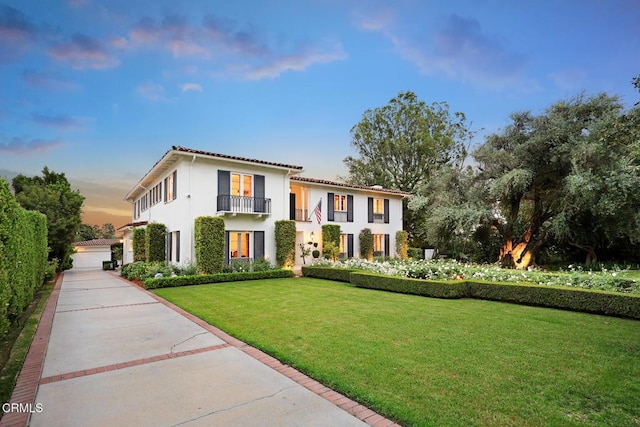 670 San Marino Ave, San Marino, CA 91108 - mediterranean / spanish house with a balcony, a front yard, and stucco siding