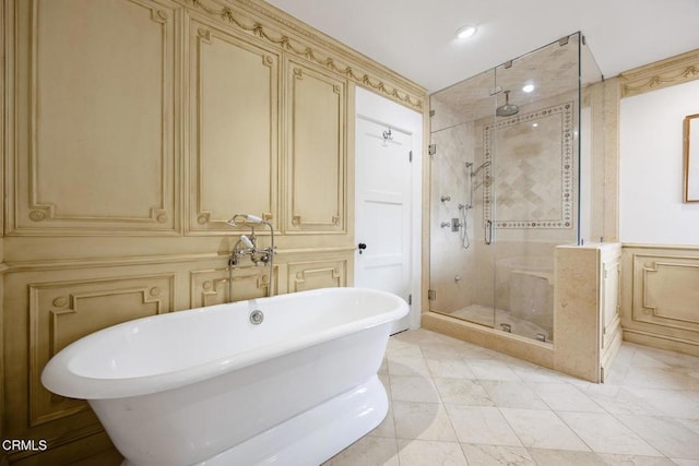 670 San Marino Ave, San Marino, CA 91108 - bathroom with a decorative wall, a shower stall, a soaking tub, marble look tiles, and recessed lighting