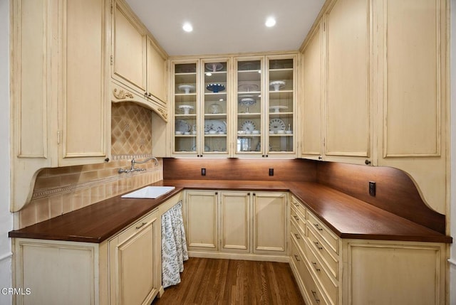 670 San Marino Ave, San Marino, CA 91108 - kitchen featuring decorative backsplash, butcher block counters, glass insert cabinets, and dark wood-type flooring