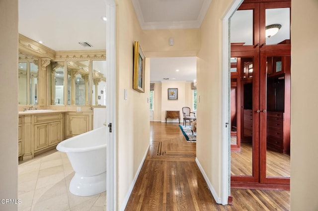 670 San Marino Ave, San Marino, CA 91108 - hallway with ornamental molding, french doors, and light wood-type flooring