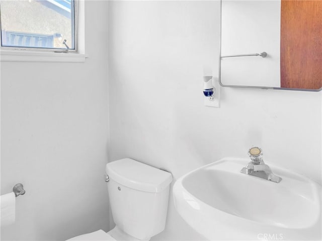 10300 Miranda Ave, Buena Park, CA 90620 - half bathroom featuring a sink and toilet