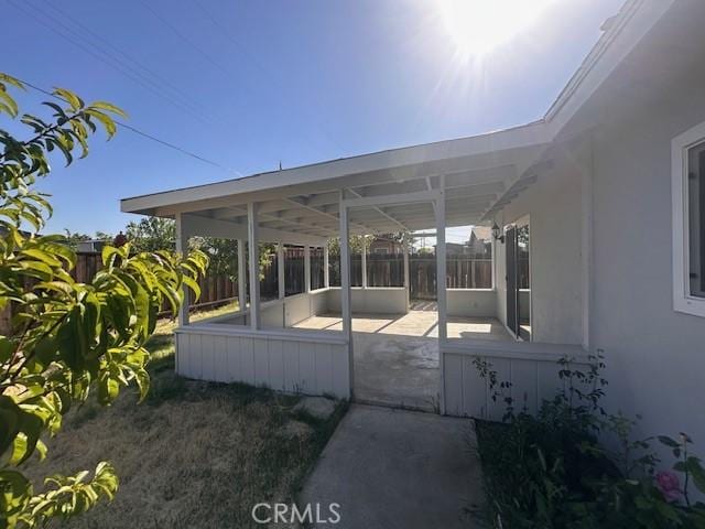 410 Orange Ave, Los Banos, CA 93635 - view of patio / terrace with fence and a sunroom