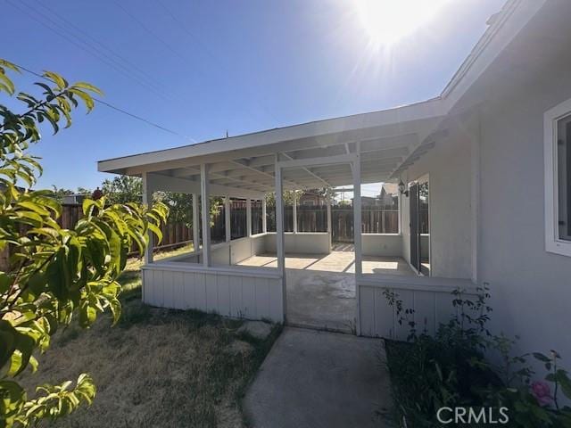 410 Orange Ave, Los Banos, CA 93635 - view of patio / terrace featuring a sunroom