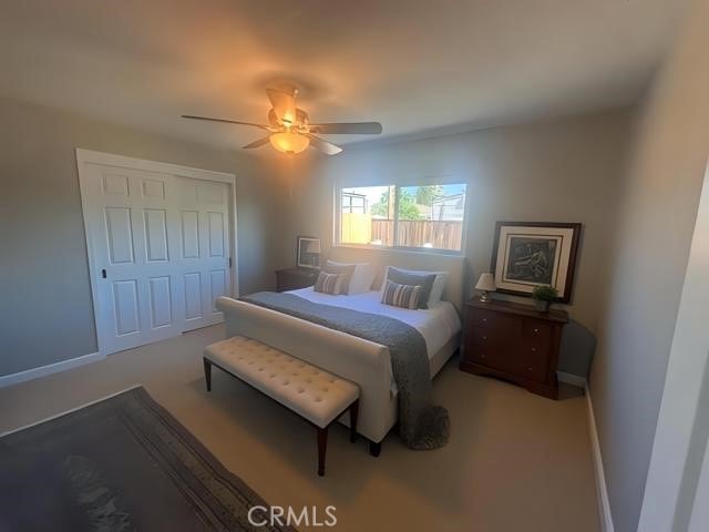 410 Orange Ave, Los Banos, CA 93635 - bedroom featuring a ceiling fan and baseboards