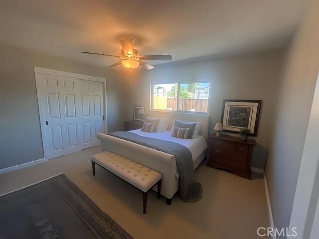 410 Orange Ave, Los Banos, CA 93635 - bedroom featuring a ceiling fan and baseboards