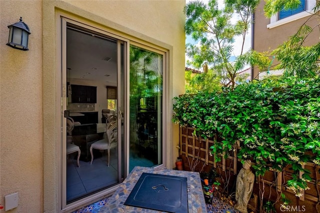 126 Brambles, Irvine, CA 92618 - doorway to property featuring stucco siding