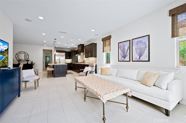 126 Brambles, Irvine, CA 92618 - living area featuring recessed lighting and light tile patterned floors