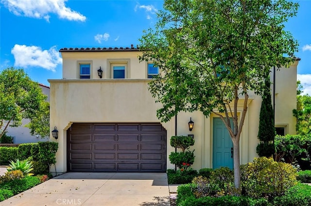 126 Brambles, Irvine, CA 92618 - mediterranean / spanish house featuring stucco siding, driveway, a garage, and a tile roof