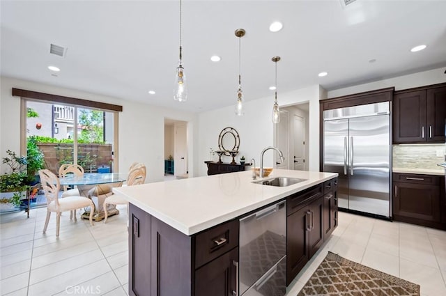 126 Brambles, Irvine, CA 92618 - kitchen with appliances with stainless steel finishes, a sink, light countertops, recessed lighting, and decorative backsplash